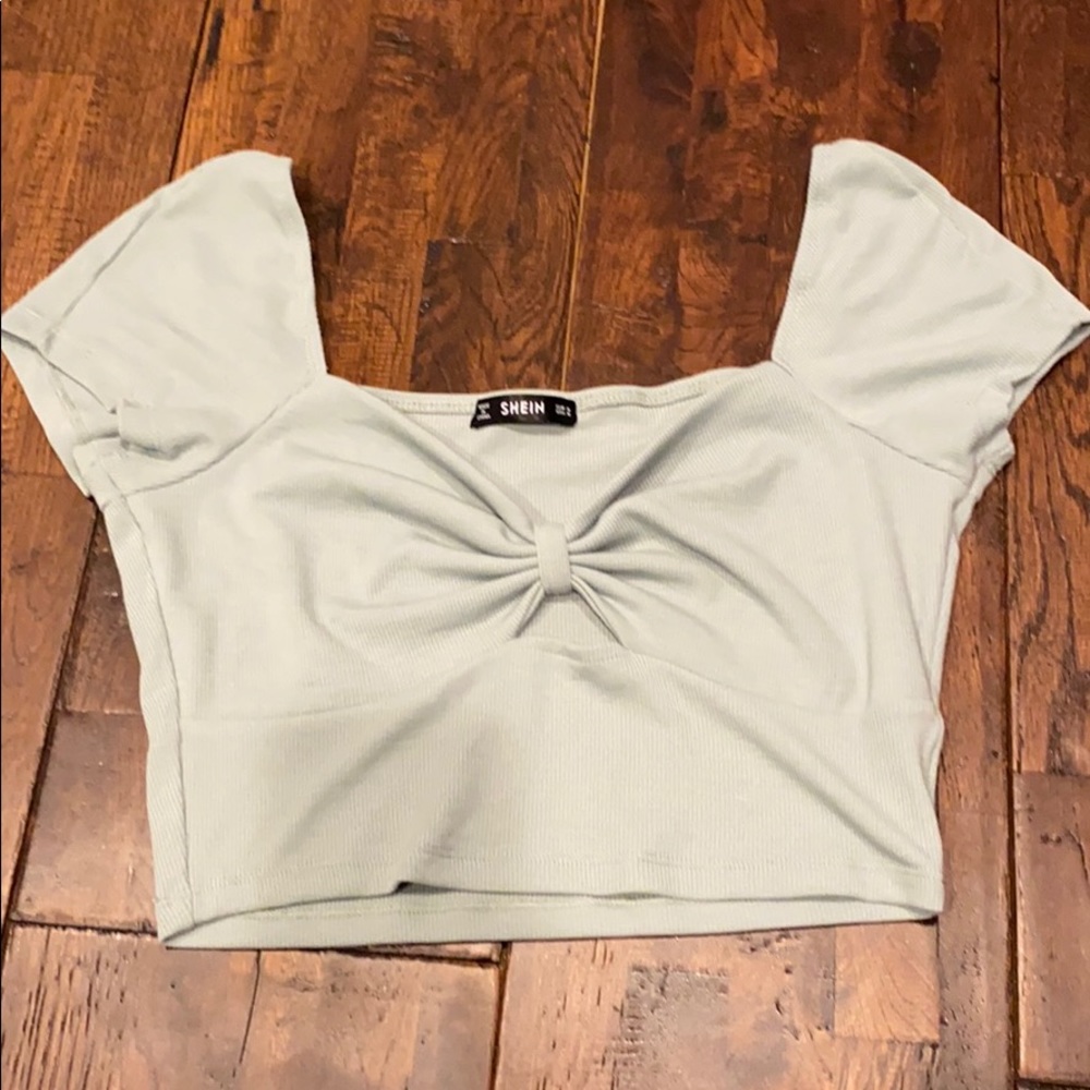 teal off the shoulder crop top